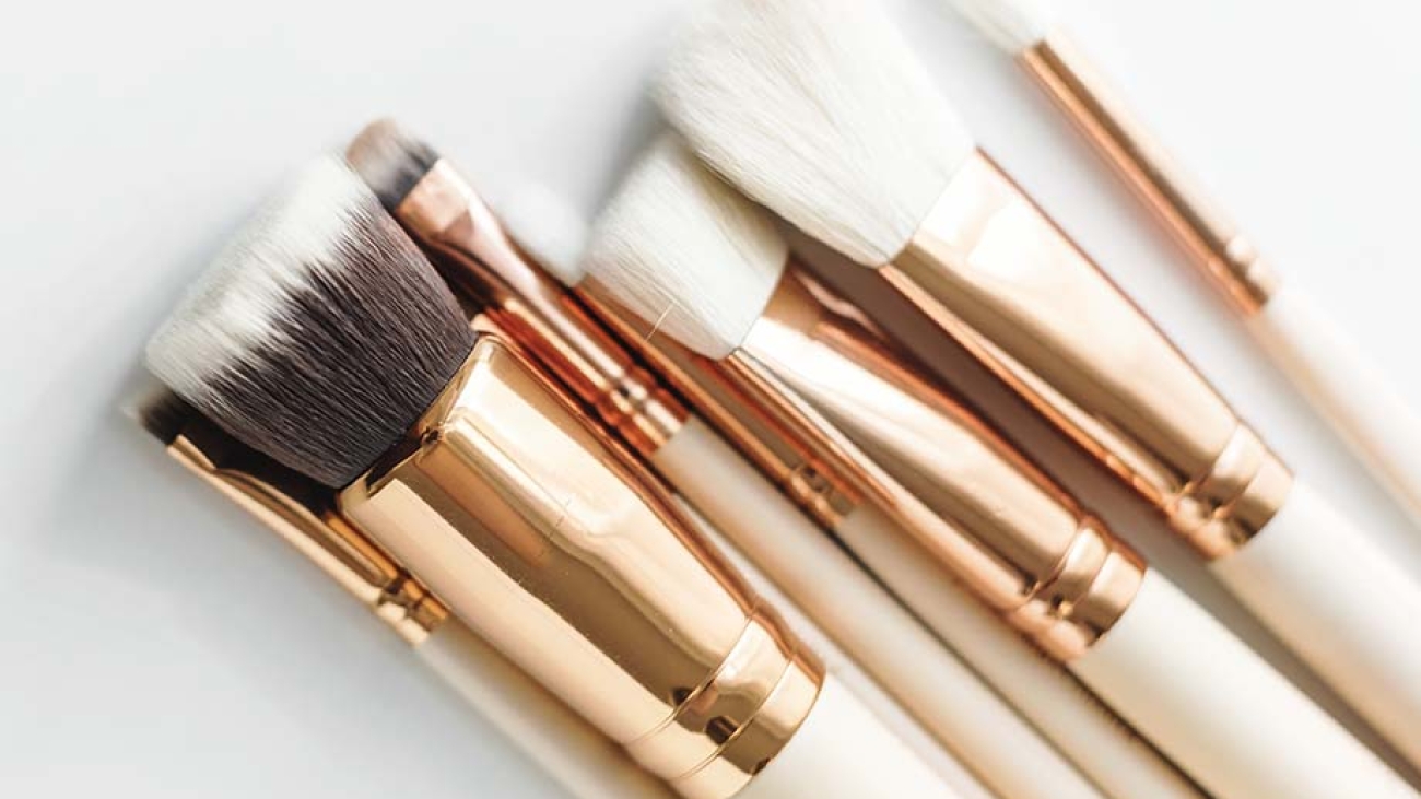 Closeup of makeup brushes on white background