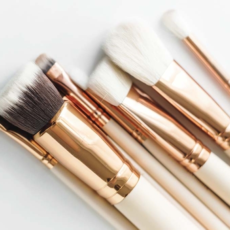 Closeup of makeup brushes on white background