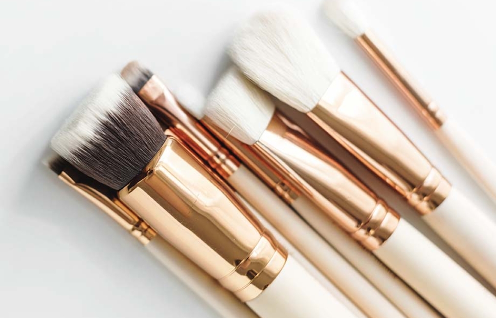 Closeup of makeup brushes on white background